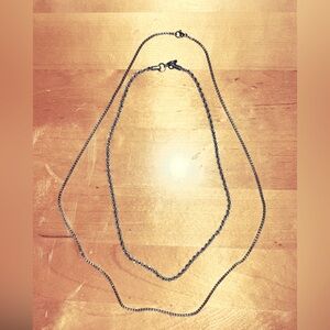 2 silver chains (one long&loose) (the other is more of a loose choker design)